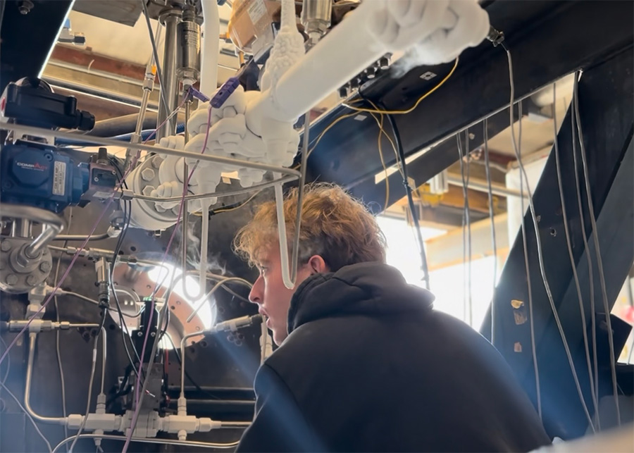 Student inspecting throttle valves