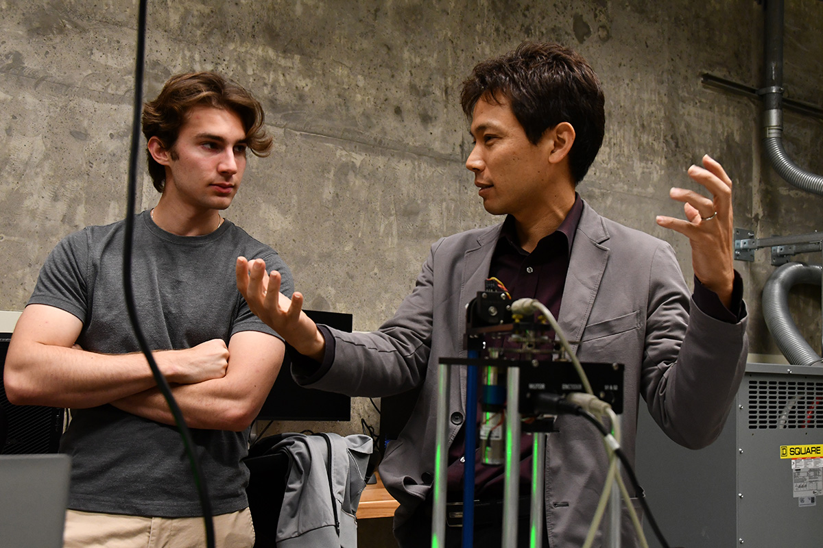 A student listening to Takashi Tanaka