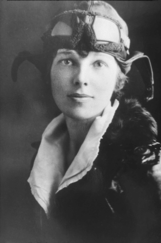 A black and white portrait of Amelia Earhart