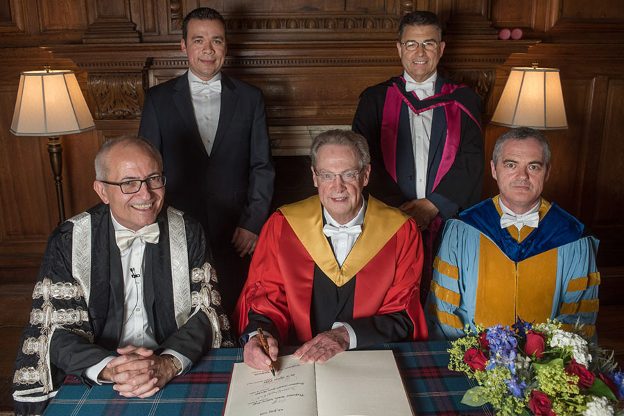 After the ceremony awarding AAE Professor R. Byron Pipes, John L. Bray Distinguished Professor of Engineering, an honorary degree at the University of Edinburgh, Pipes (middle front) was joined by Edinburgh's Acting Vice Chancellor Charlie Jeffery (left front), head of Edinburgh's School of Engineering and Professor Conchúr M. Ó Brádaigh (right front), current Purdue doctoral student Eduardo Barocio (left rear) and another member of the University Court (right rear). All are shown wearing the white bow tie, an Edinburgh tradition for male graduation participants.
