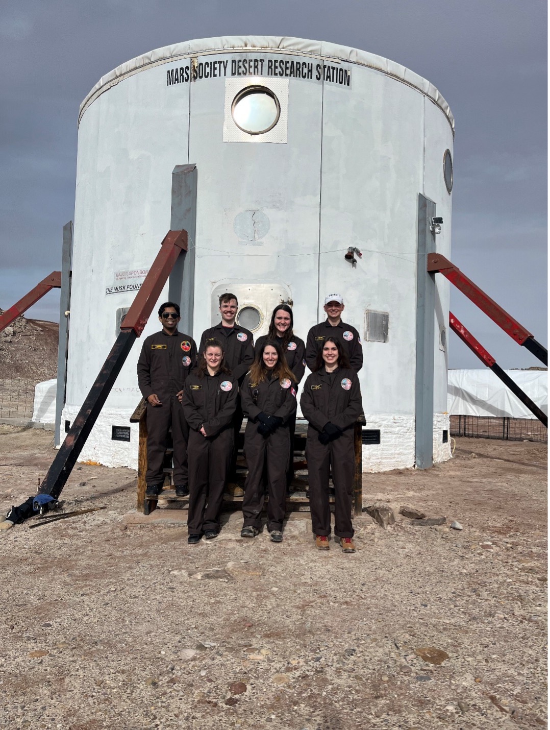 group photo of the crew in front of the MDRS