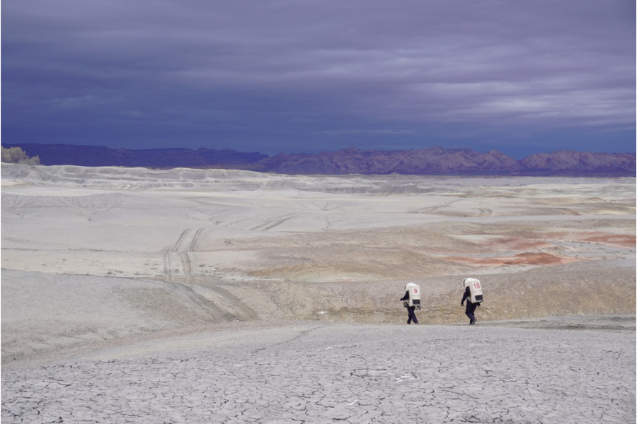 Analog astronauts exploring terrain