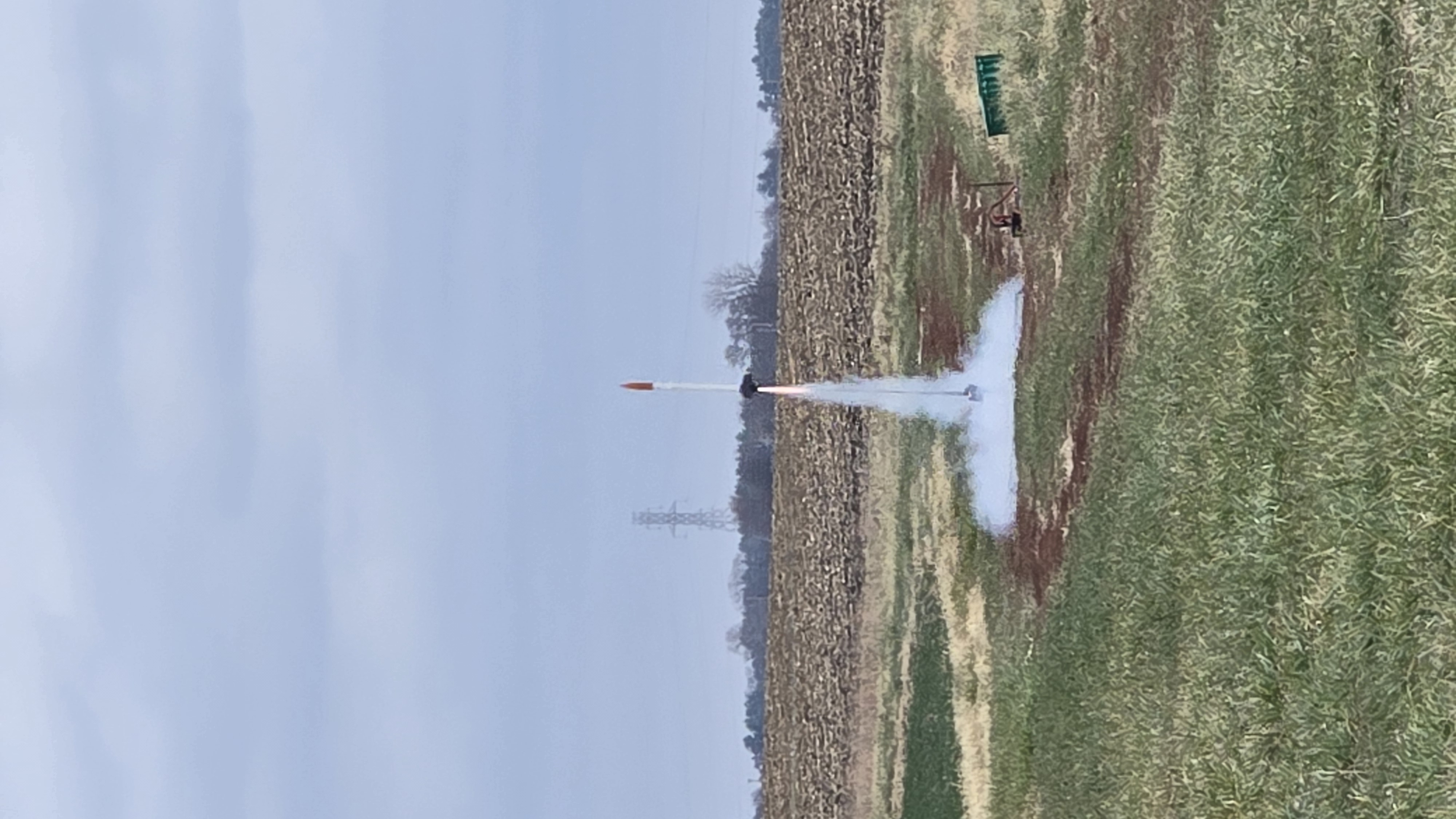 A student-designed rocket lifts off during the final launch test, putting its custom solid rocket motor design to the test.