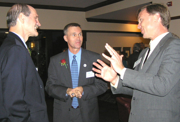 Professor Farris talks with 1999 OAE Guy Gardner and 2003 OAE, DEA John Hudson at the 2005 Outstanding Aerospace Engineer Awards Reception