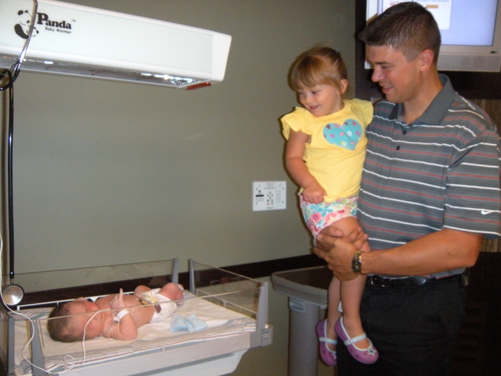 Jason and Jocelyn Brown admire the newest addition to the family, Jonathan