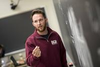 Andre Woloshuk at chalkboard