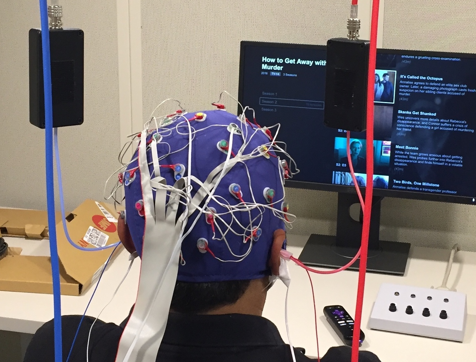 Electrodes on a test subject's head and in the ear canal measure the brain's response to auditory stimuli.