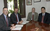 George R. Wodicka (left) and UPRM administrators and faculty