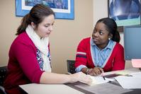 View larger image of Jana Castellanos (left) with student