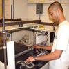 Gaurav Sant, undergraduate student, with research equipment 