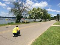 Rodrigo Netto places traffic counters on County Road S 210 in Starke County, Indiana, near Bass Lake