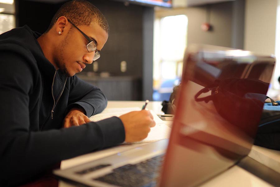 student working on coursework