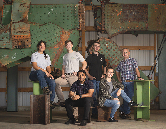 Rob Connor, the Jack and Kay Hockema Professor of Civil Engineering (at right), with Myriam Sarment, PhD researcher; Tom Welch, graduate student and research engineer; Chandan Kanakamedala (MS CE21), PhD candidate; Charles Kieffer, PhD student and research associate for S-BRITE; and Aurora Ebert, PhD student; at the S-BRITE Center.