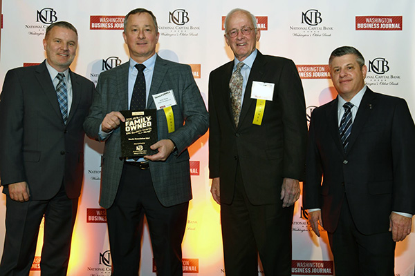 Steele Foundation LLC of McLean, Virginia, was one of just 15 Greater Washington, D.C. area companies recently honored in the fourth annual Washington Business Journal Family-Owned Business Awards competition. Accepting the award are President J. Andrew (Andy) Steele (second from left) and his father Ronald Steele (second from right), who is the companys Founder and Managing Member. Flanking them are Washington Business Journal Editor-in-Chief Douglas Fruehling (far left) and Publisher Peter Abrahams (far right). Award recipients were honored at a February 28 event in Washington, D.C.