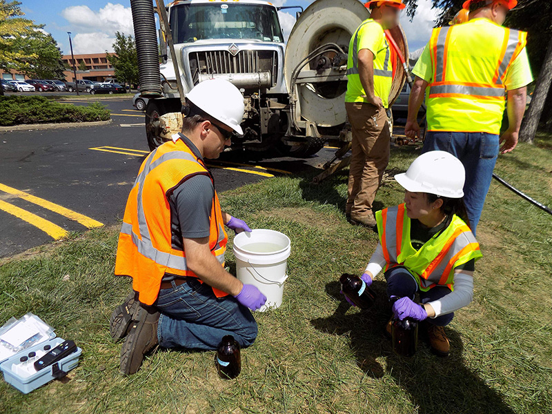 Purdue University assistant professor Andrew Whelton (left) says that although a process of repairing storm water culverts has been used for approximately 30 years, still not much is known about the chemicals released into the water during the repairs. (Purdue University photo)