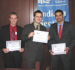 Joshua Zvolanek, undergraduate student, Andrzej M. Kwasniak and Anuj Sharma, graduate students, receiving the Cox Memorial Transportation Award