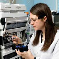 Holly Haflich puts nitrogen compound samples in the liquid chromatograph/mass spectrometry instrument, which separates and quantifies organic compounds.
