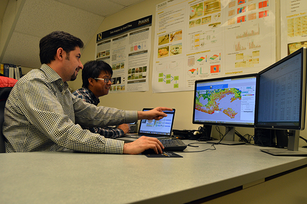 Assistant Professor Mohammad Jahanshahi and PhD candidate Fu-Chen Chen review the data, which includes thousands of structure images throughout coastal Louisiana.