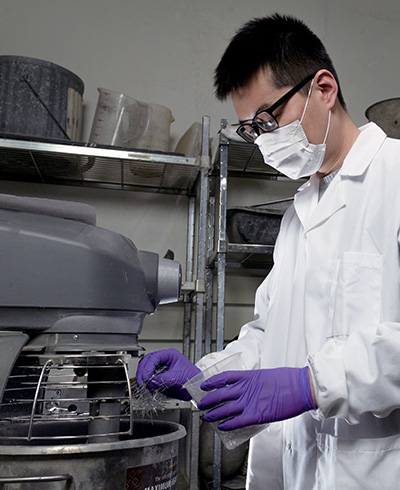 Siwei Ma, postdoctoral scientist, tests SAP compounds for optimum use in self-healing concrete.