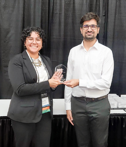 Lauren Jenkins and Rajat Verma accept the 2023 Best Student Chapter Award during the ITE Annual Meeting in August.