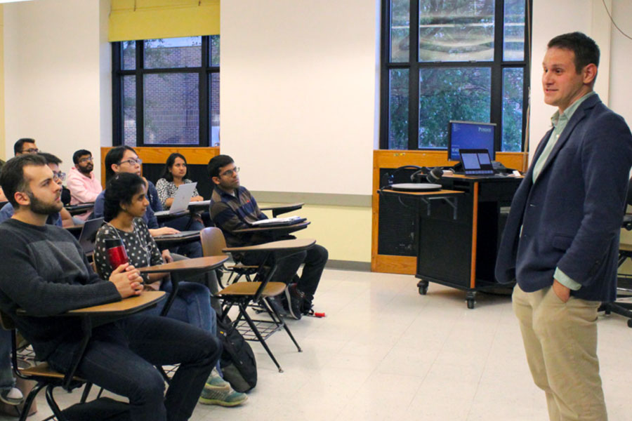 Photo of Dr. Brett Savoie teaching a data science course
