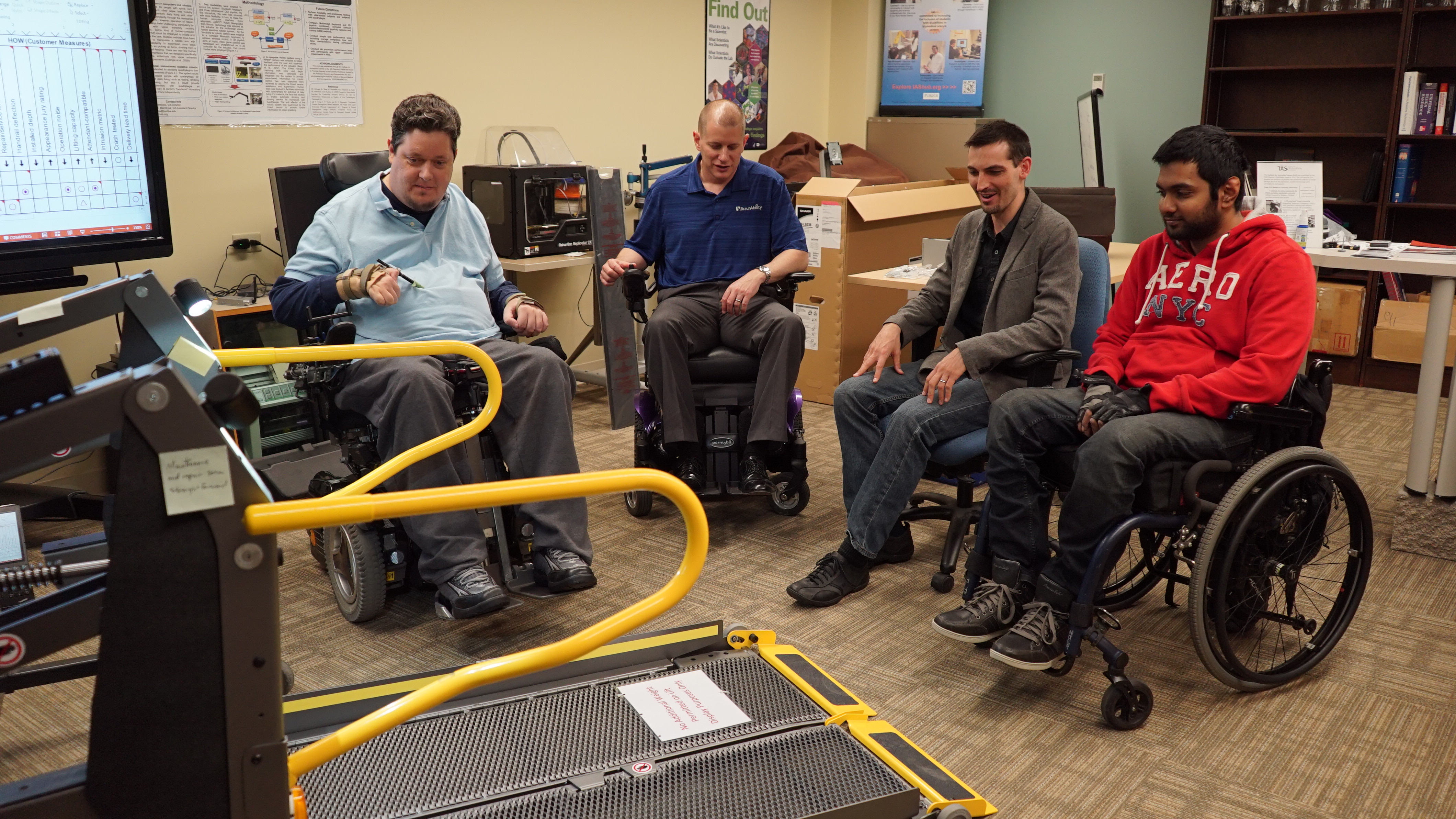 Photo of group evaluation of a wheelchair lift