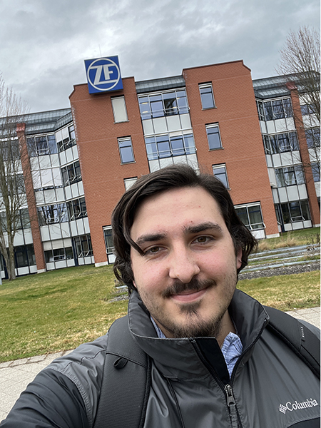 A selfie of computer engineering student, Zachary Reichel, in front of his co-op job at ZF Friedrichshafen in Germany.