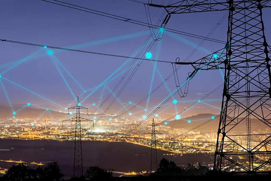 Stock image depicting a city at night from a hilltop. The city is lit up with the night lights and power lines appear in the foreground. Superimposed on the image are lines and dots symbolizing networking.