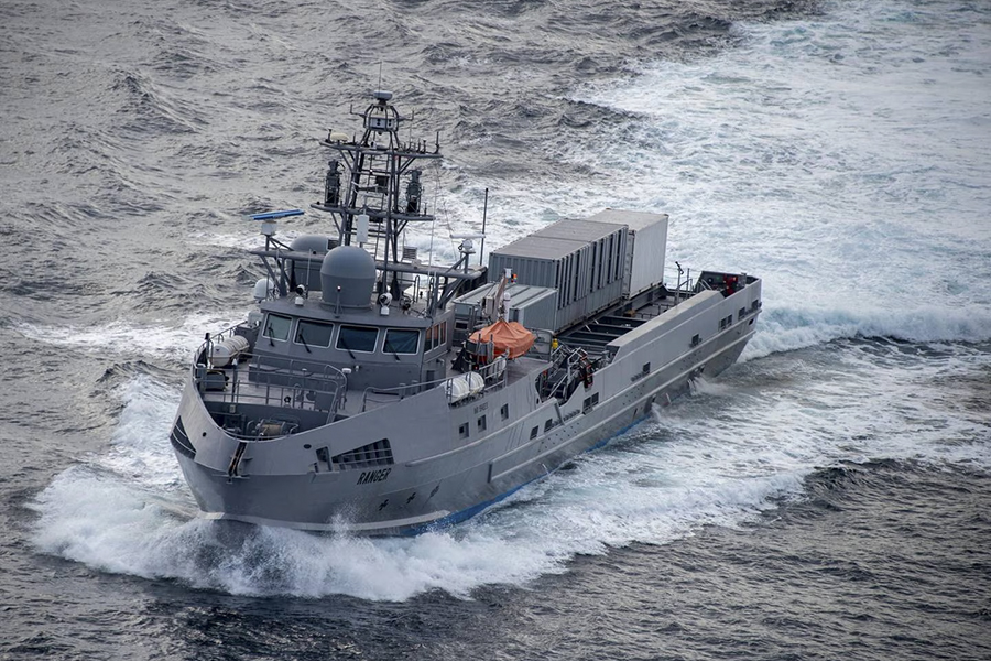An unmanned surface vessel named Ranger is making its way across the Pacific Ocean. A large wake follows behind the vessel which is mostly gray in color.