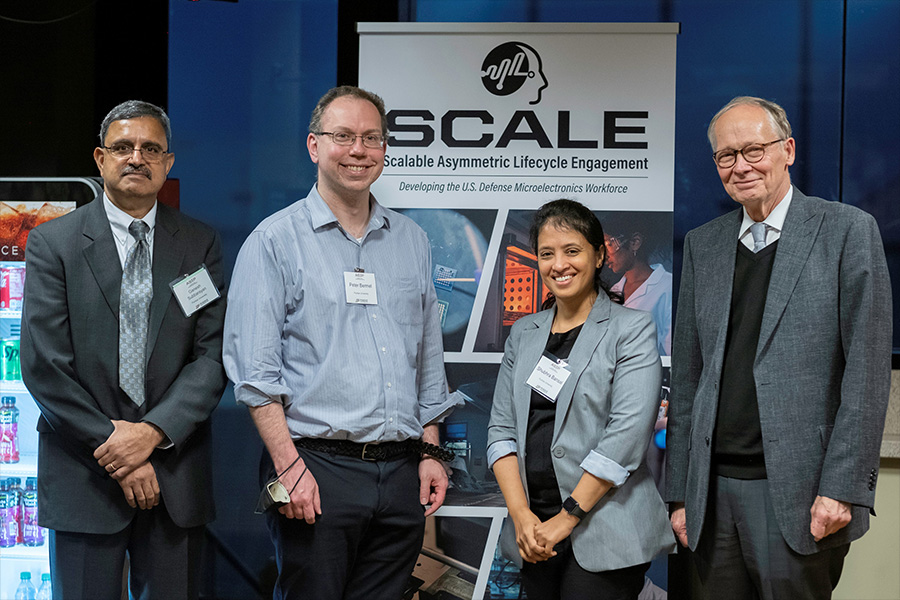 Ganesh Subbarayan, Peter Bermel, Shubhra Bansal, and Mark Lundstrom stand in front of a SCALE banner