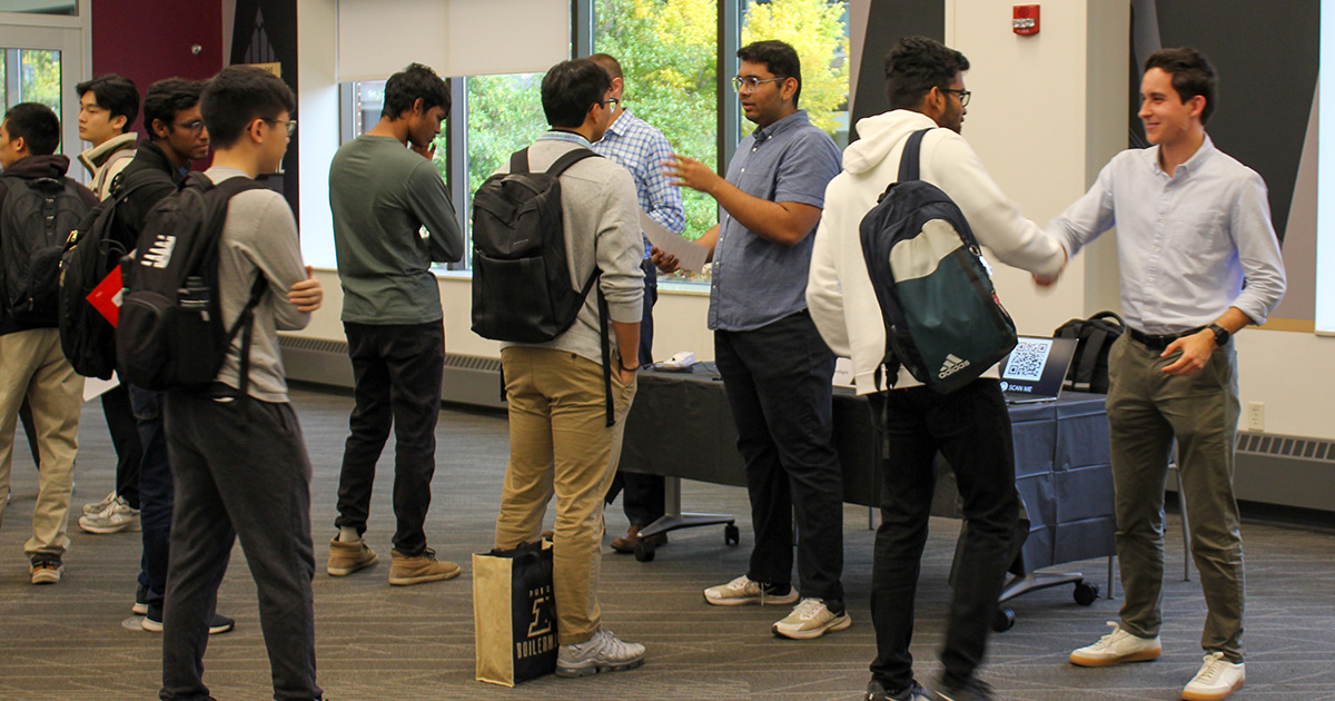 students lined up to meet with organizations at job fair