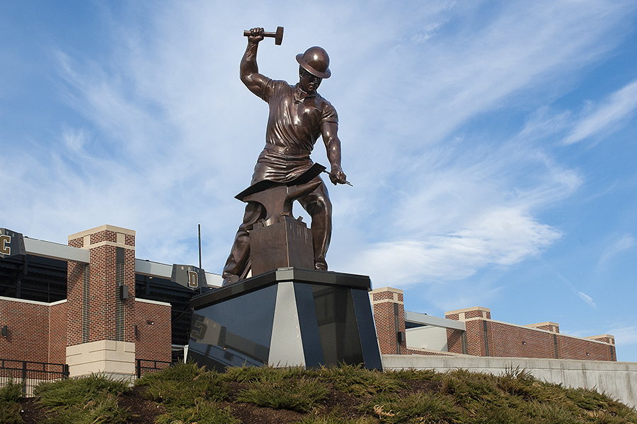 statue of a boilermaker by ross-ade stadium on purdue's campus