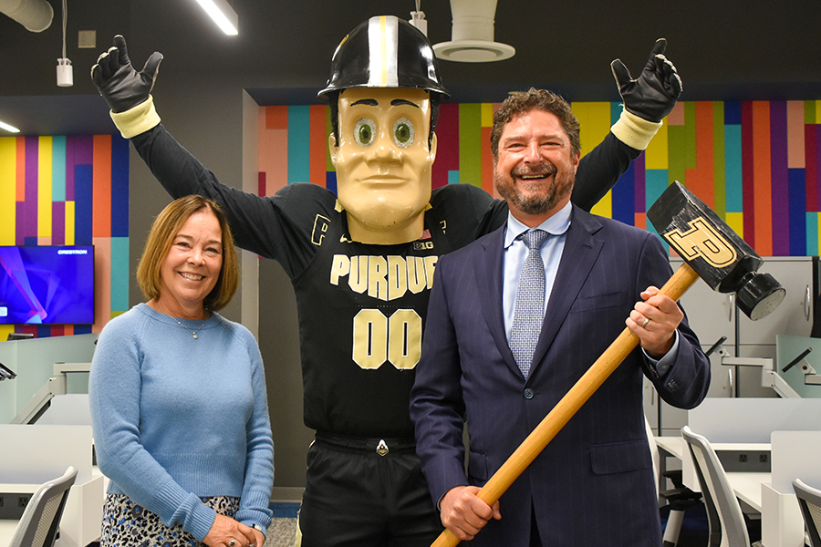 Laura and John pose for a picture with Purdue Pete, the Purdue mascot.