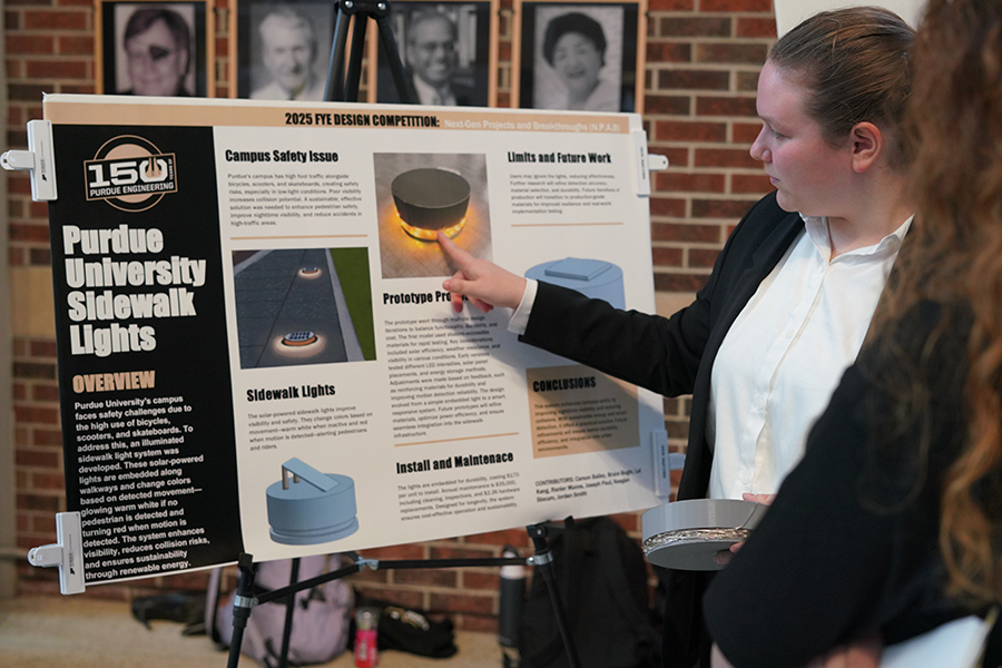 Student presenting poster session