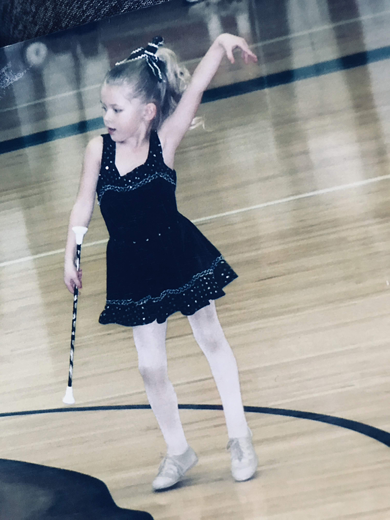Young Emma performing baton