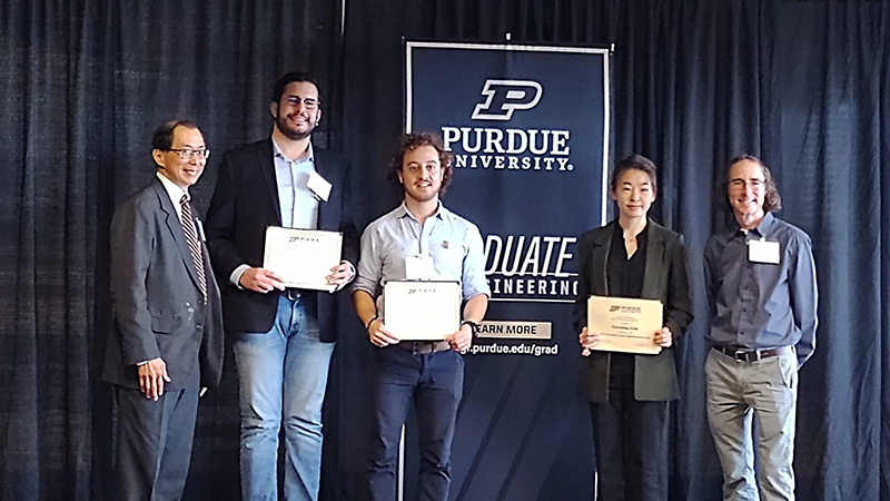 Graduate Student Honorees hold awards with mentors Drs. Michael Loui and Brent Jesiek