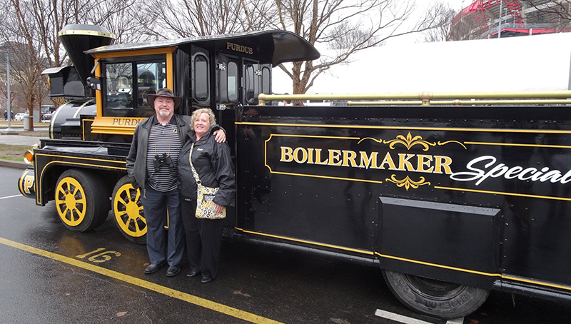 Dr. Bob and his wife posing with the Boilermaker Special