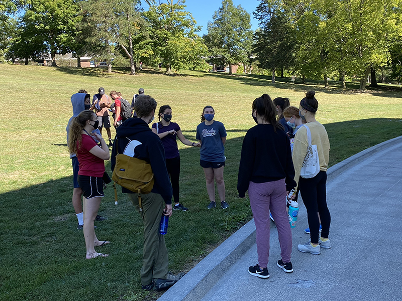 First-Year Engineering students talking on Slayter Hill