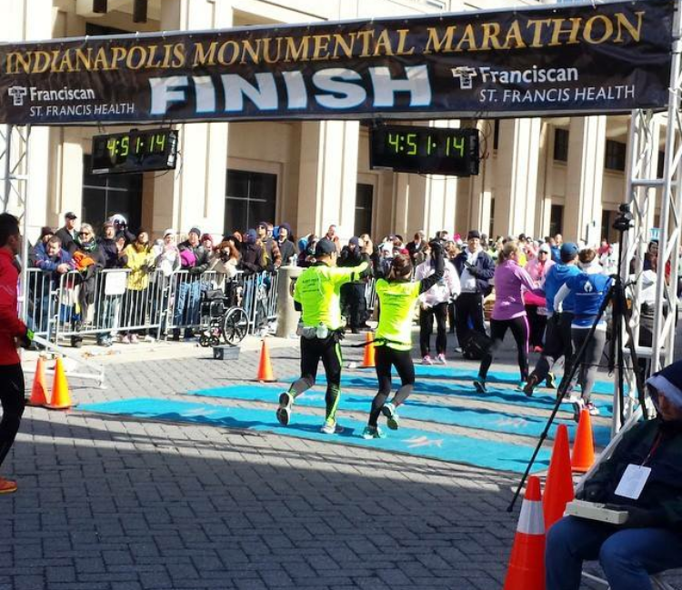 Lucero Campos with her dad at the finish line of her first full marathon.