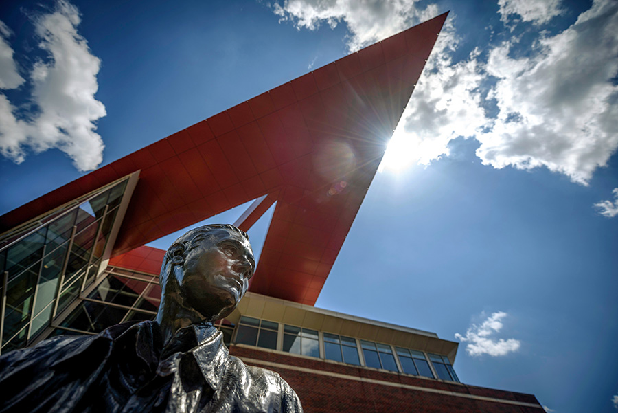 Armstrong statue with a building behind it