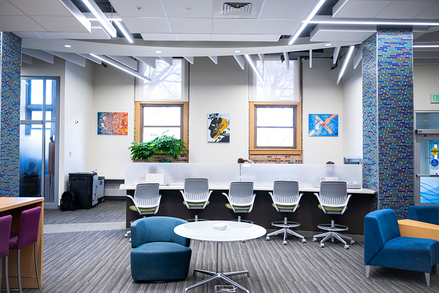 Interior of Grissom Hall lobby, with paintings on walls