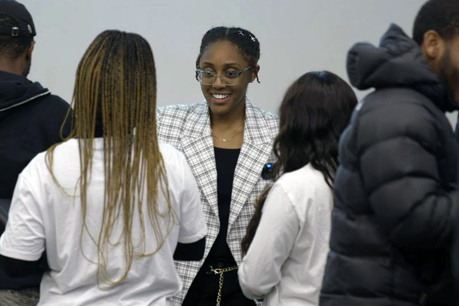 Kyndall Davis surrounded by other NSBE members