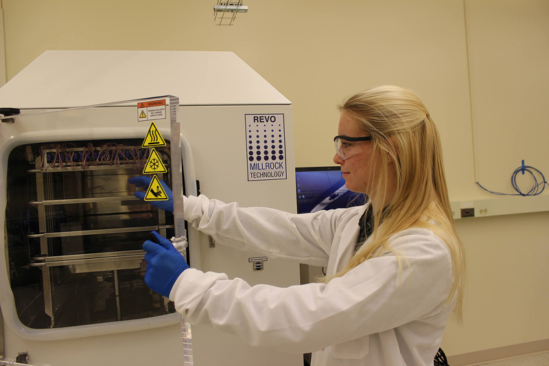 A graduate student loads a freeze dryer at Purdue University’s LyoHub facility in Birck Nanotechnology Center. LyoHub has a comprehensive laboratory for freeze-drying development, optimization and training.