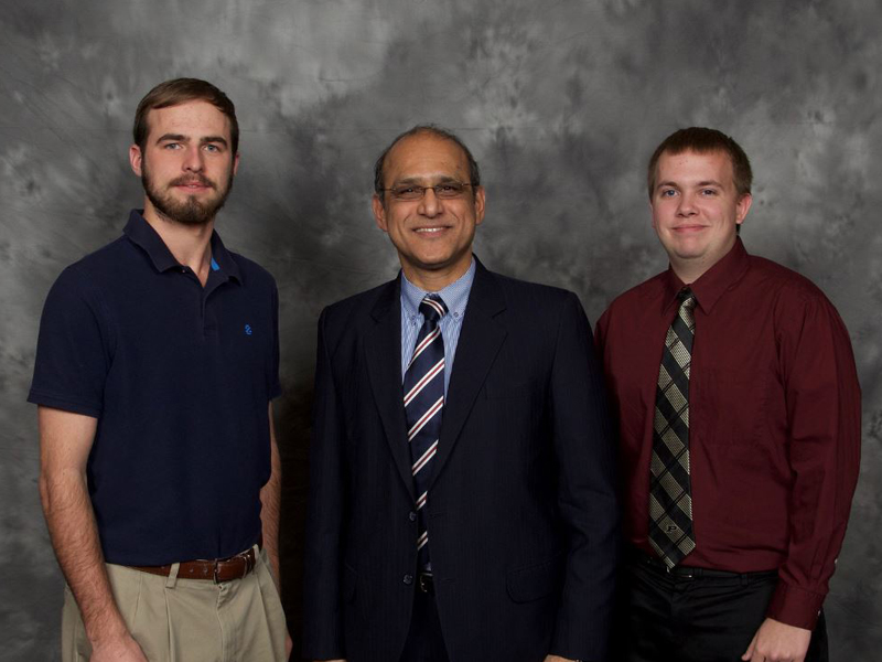 CEM Professor and Head Makarand Hastak, middle, joins Jason Buechlein (BSCEM ”19), left, and Alexander Mahan (BSCEM ”19), right, at the APAI 2017 Scholarship Awards Banquet. Buechlein and Mahan were among the 24 APAI scholarship recipients for 2017.