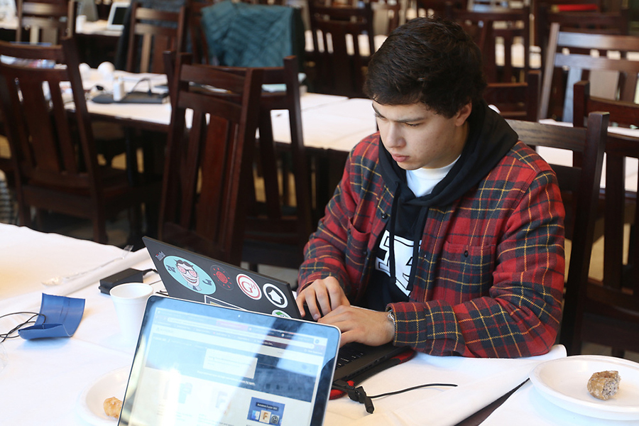 Junior Agricultural Engineer Trey Ladyman works on his computer to refine his irrigation hose design.