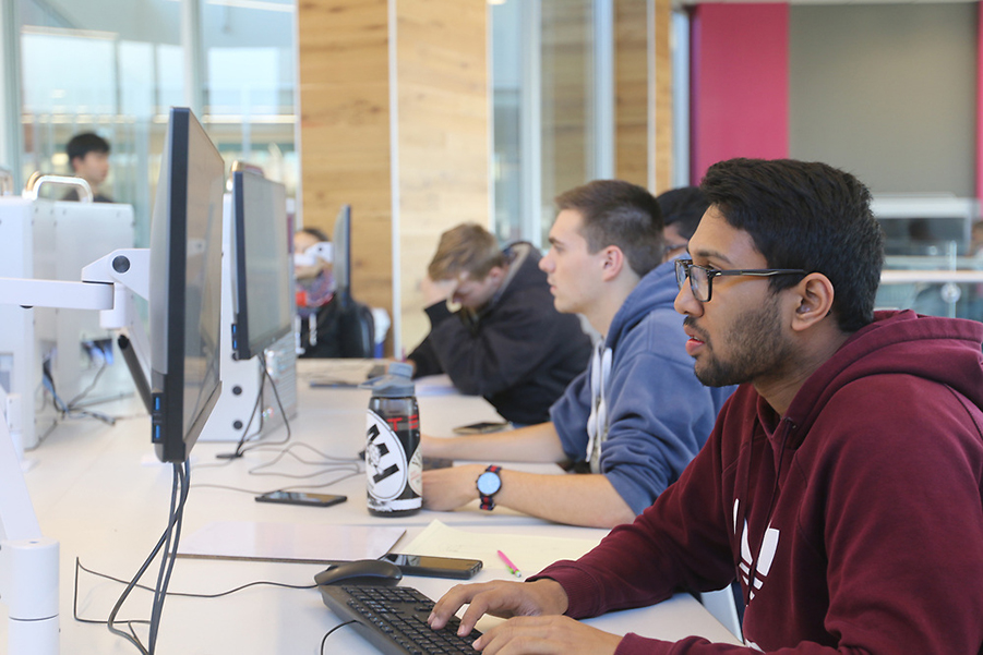 Junior ME Akshay Rao works on his smart rain barrel design in the Bechtel Innovation Design Center.