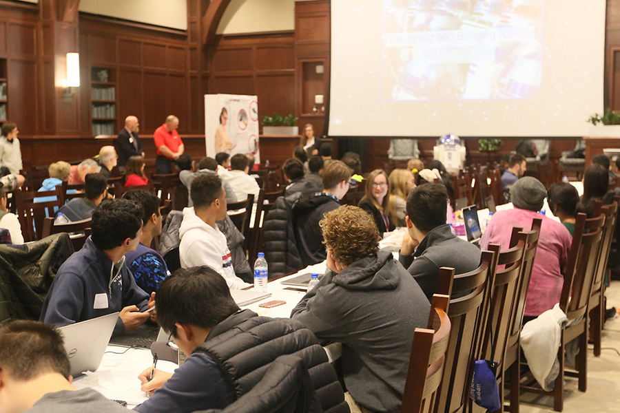 Participants listen attentively to a presentation given by Alexandra Forsythe.