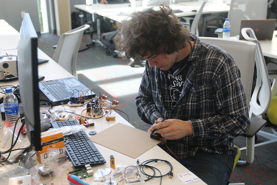 Sophomore Mechanical Engineer Tony Kramer works on a circuit for his product in the Bechtel Innovation Design Center.