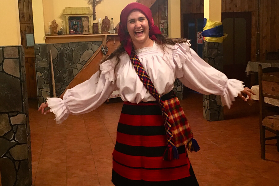 ENE Multidisciplinary Engineering student Paige Rudin in Maramures, Romania, in traditional dress while learning some new dance moves.