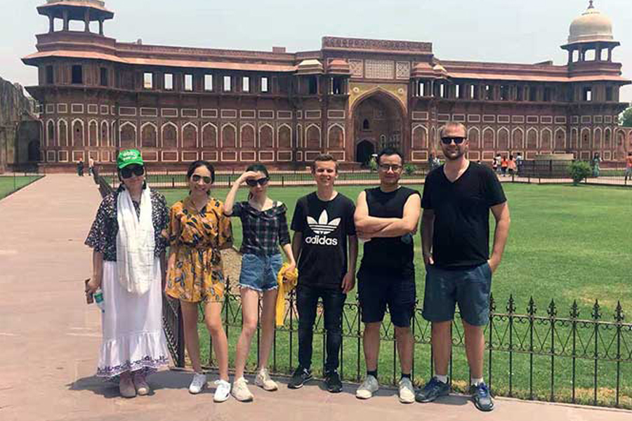 India-TVS interns pose in front of Agra Fort.